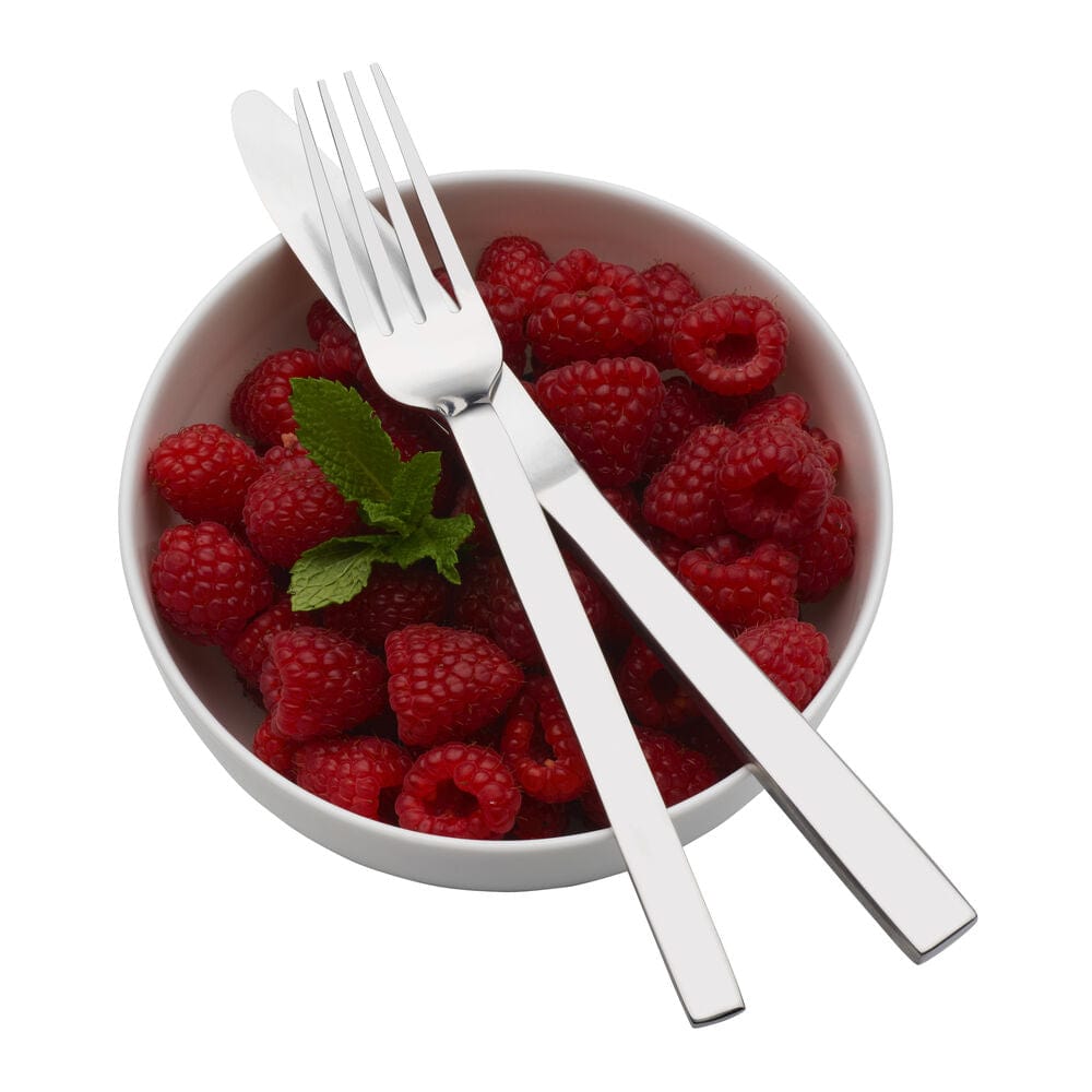 Flatware set arranged on a modern dining table for dinner party