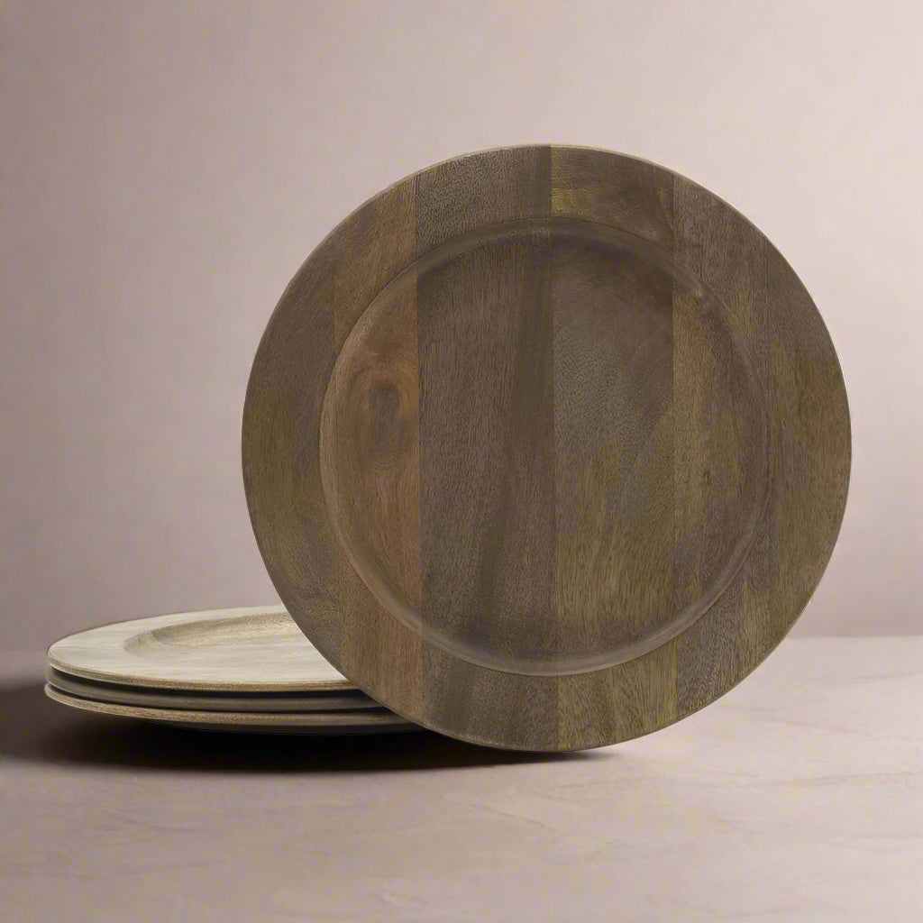 Close-up of natural mango wood charger plates with rustic finish