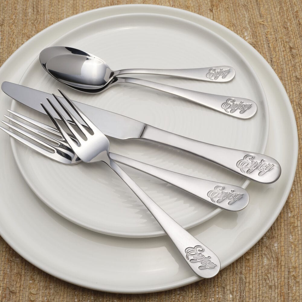 Dishwasher safe flatware set being washed in a modern dishwasher