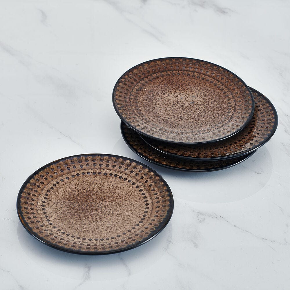 Close-up of Cambria stoneware appetizer plates with embossed beading design