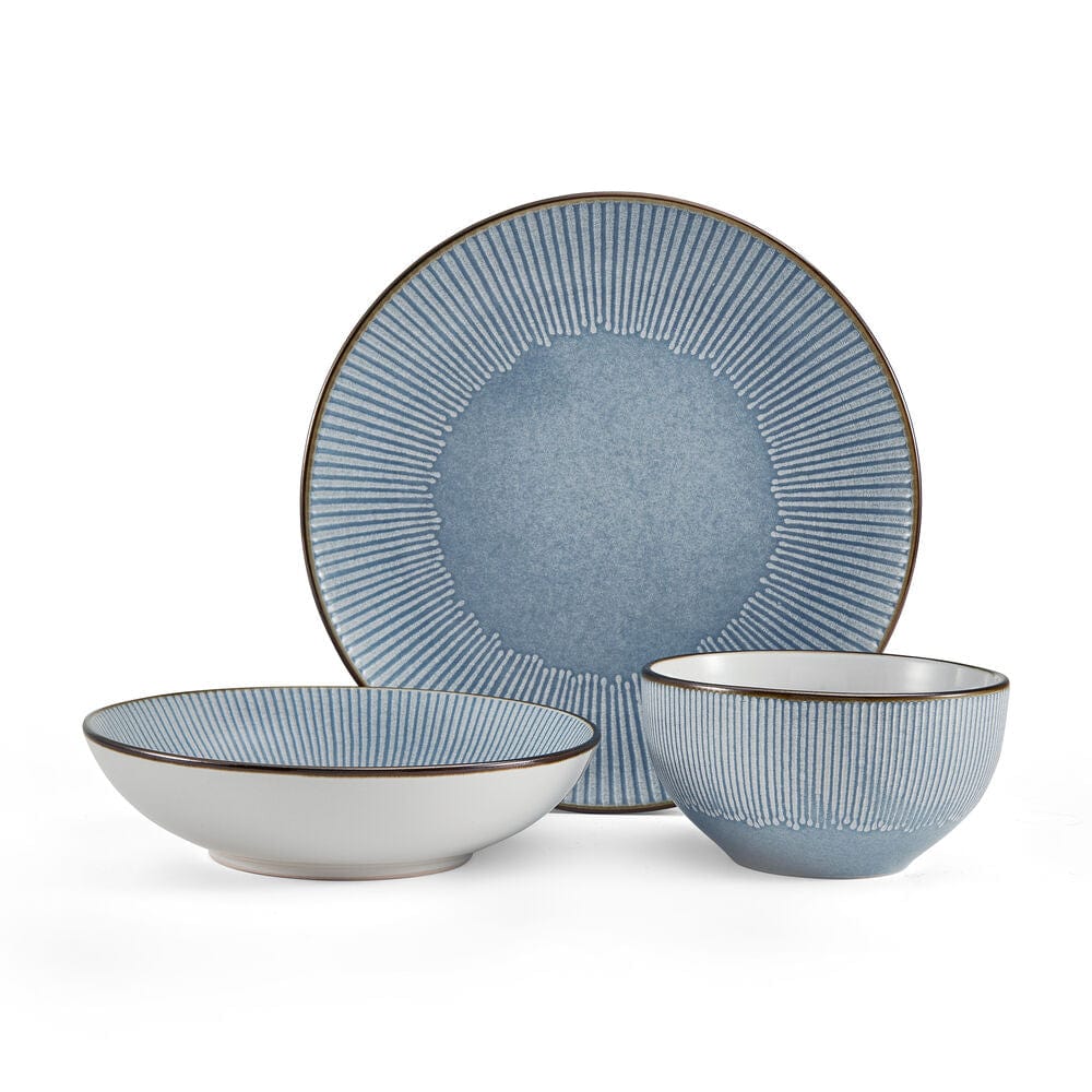 Close-up of embossed blue dinner plates with metallic rim detail