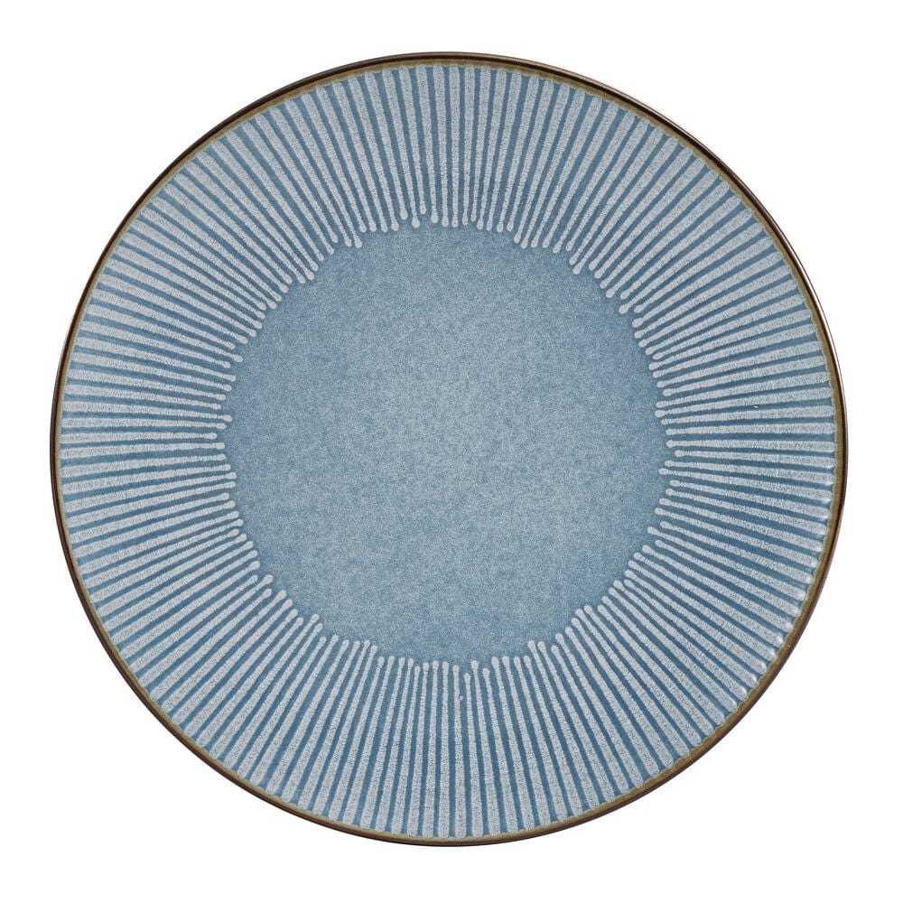 Close-up of embossed blue dinner plates with metallic rim detail