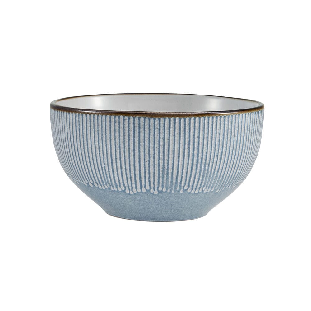 Elegant blue dinnerware set displayed on a contemporary dining table