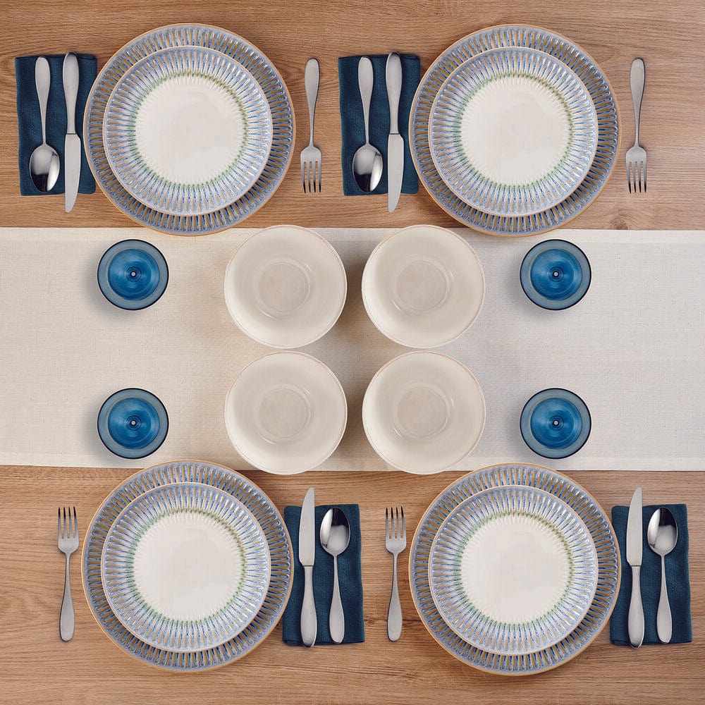 Close-up of embossed blue border and reactive glaze finish on stoneware dishes