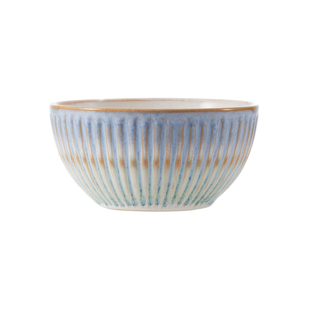 Close-up of embossed blue border and reactive glaze finish on stoneware dishes