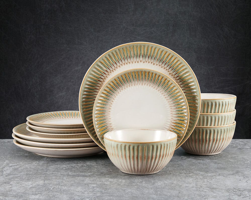 Top view of Hensley Green stoneware dinnerware set arranged on rustic wood table