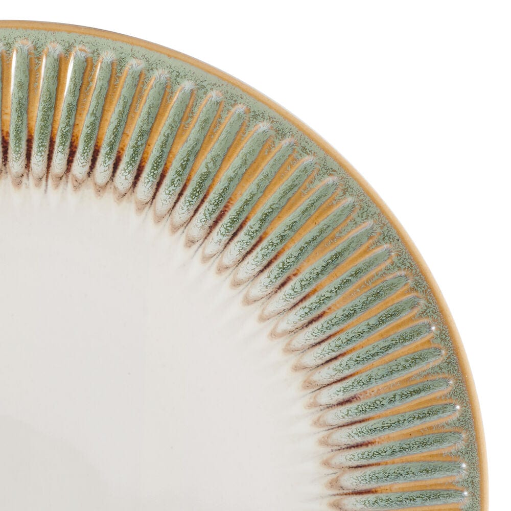 Side angle showcasing embossed pattern and reactive glaze finish on dish sets
