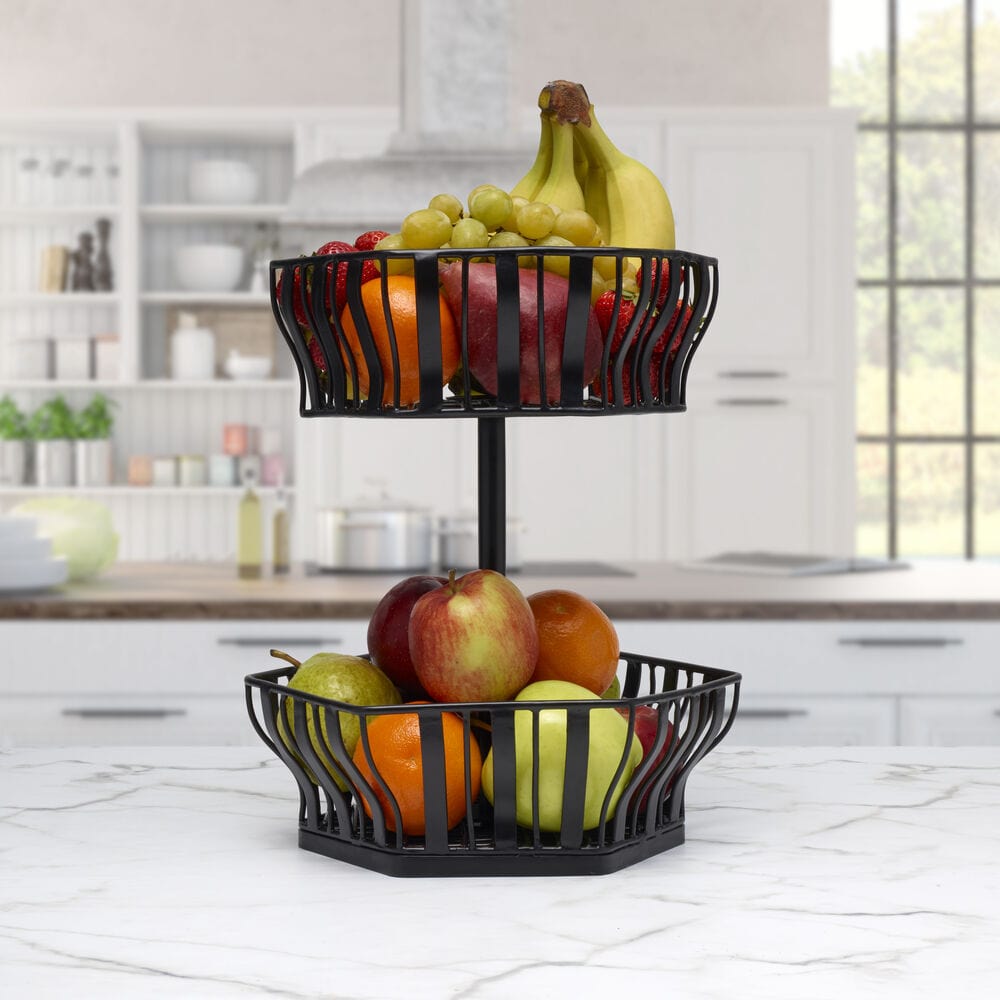 Lifestyle shot of the cheap 2 tier storage basket set on a kitchen counter filled with fresh fruits.