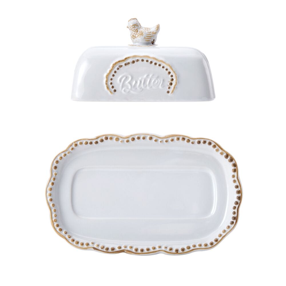 Butter dish displayed on a wooden table, enhancing rustic kitchen decor.