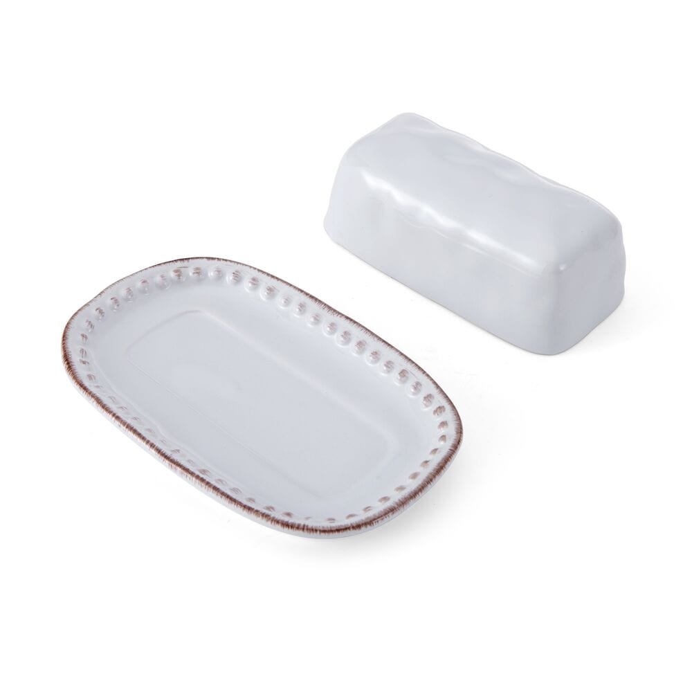 Side view of large ceramic butter dish with beaded rim and dents