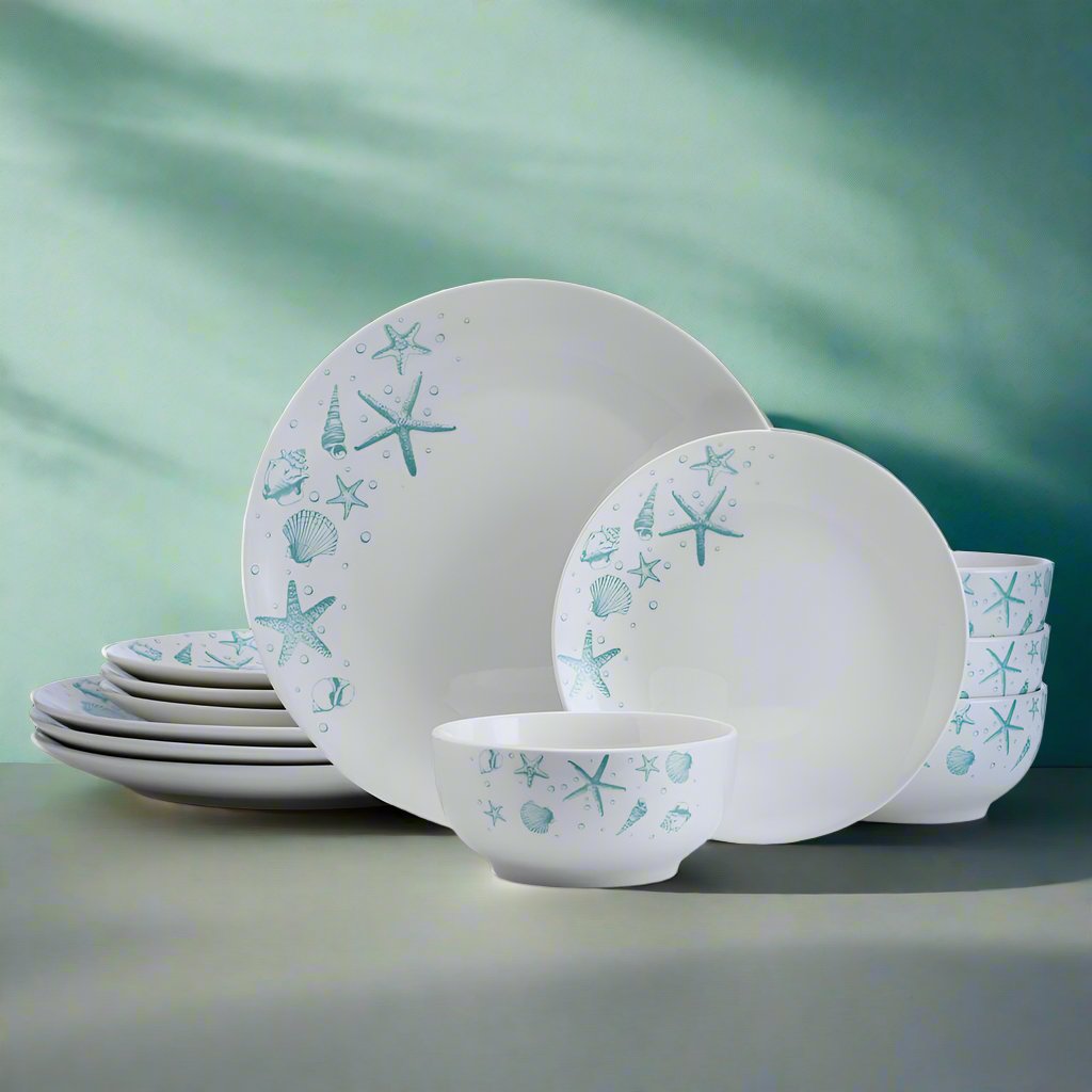 Whimsical ocean blue dinnerware set with starfish and seashells on a dining table