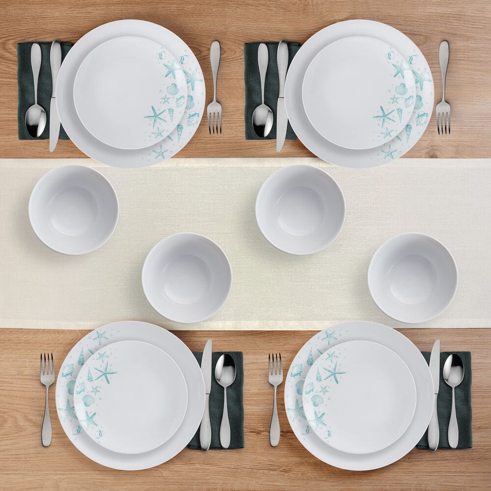 Close-up of porcelain dinnerware with beach-themed ocean blue pattern