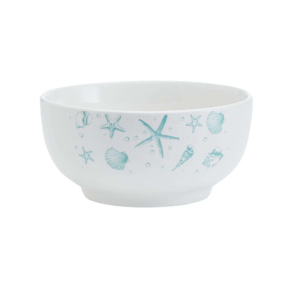 Close-up of porcelain dinnerware with beach-themed ocean blue pattern