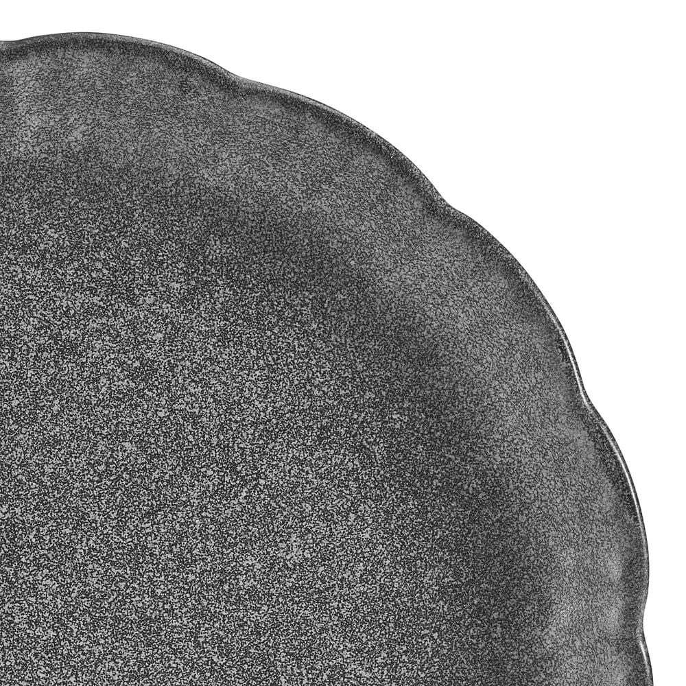Close-up view of the Noah Dinnerware Set highlighting the debossed detail and unique glazing.
