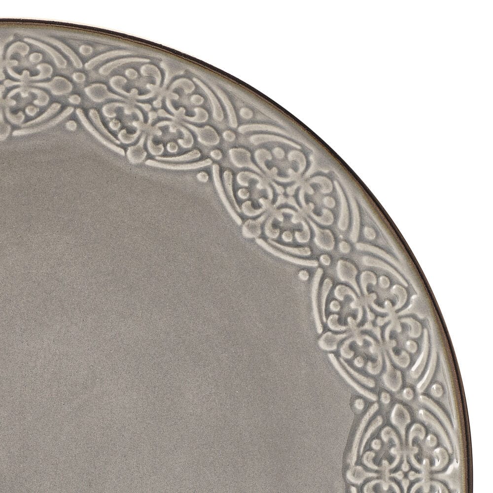 Close-up of dinner plates and bowls from the Emma dinnerware set, showcasing metallic rim detail