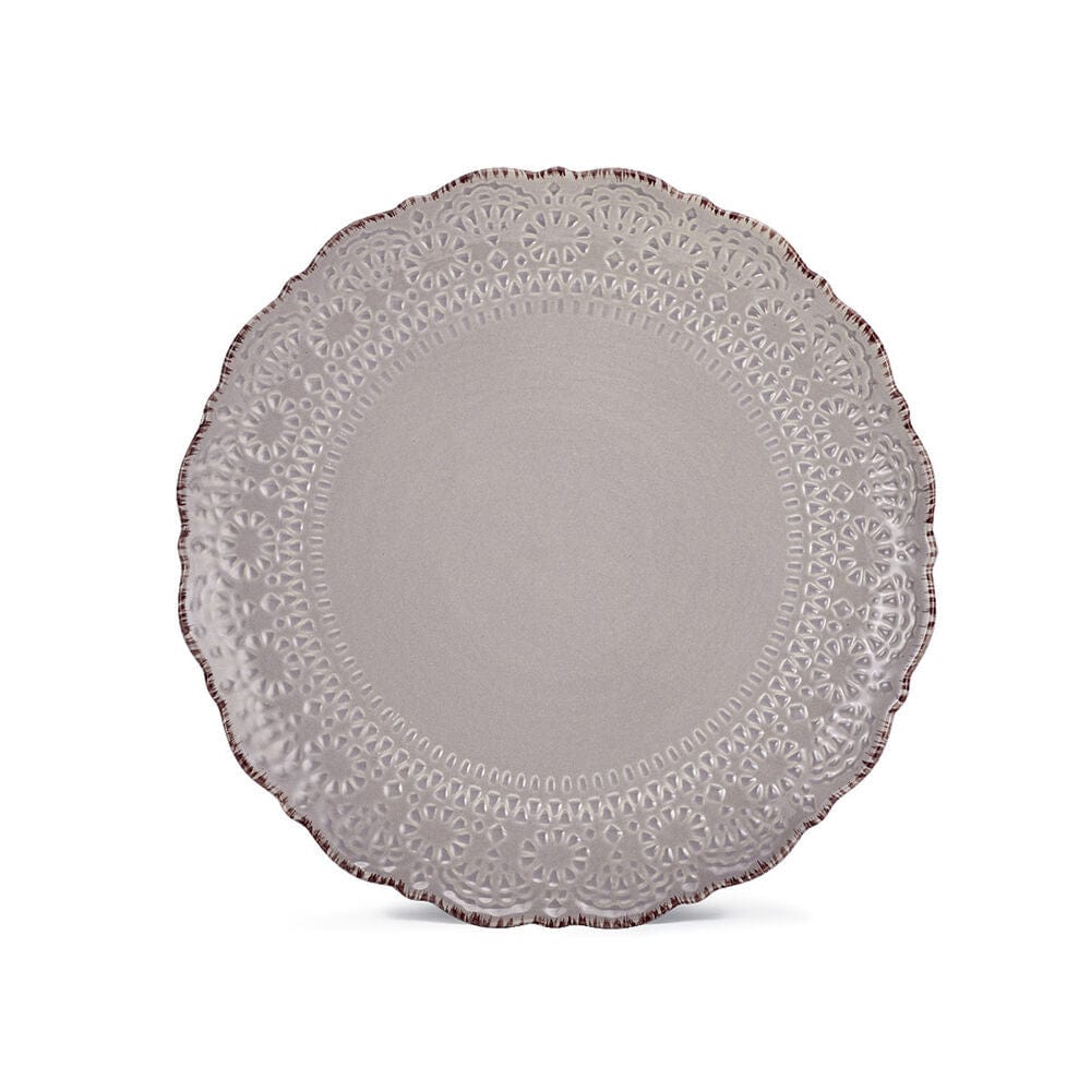 Modern dinner plate with lace design displayed in a close-up view