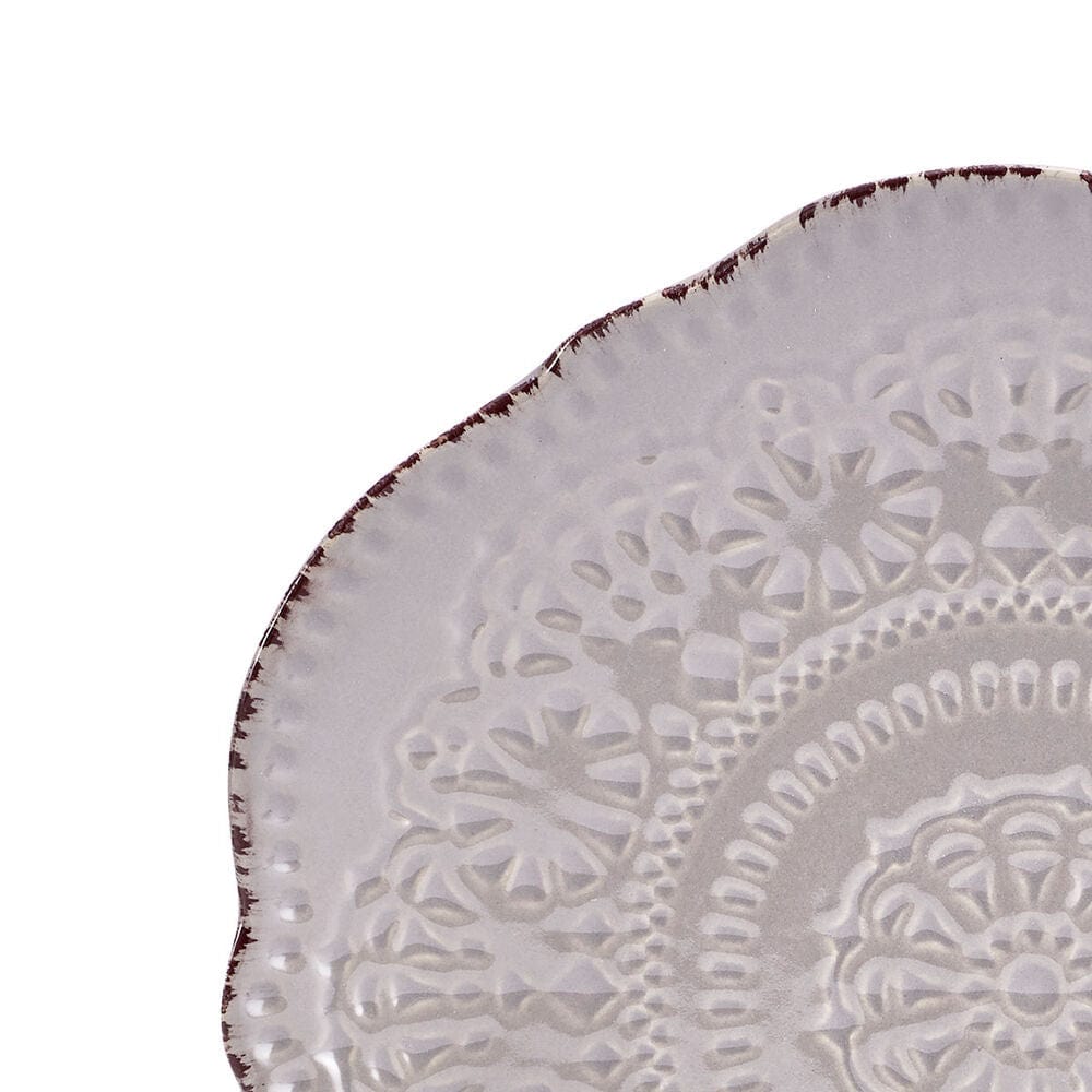 Set of four stoneware dishes arranged on a modern dining table for everyday use