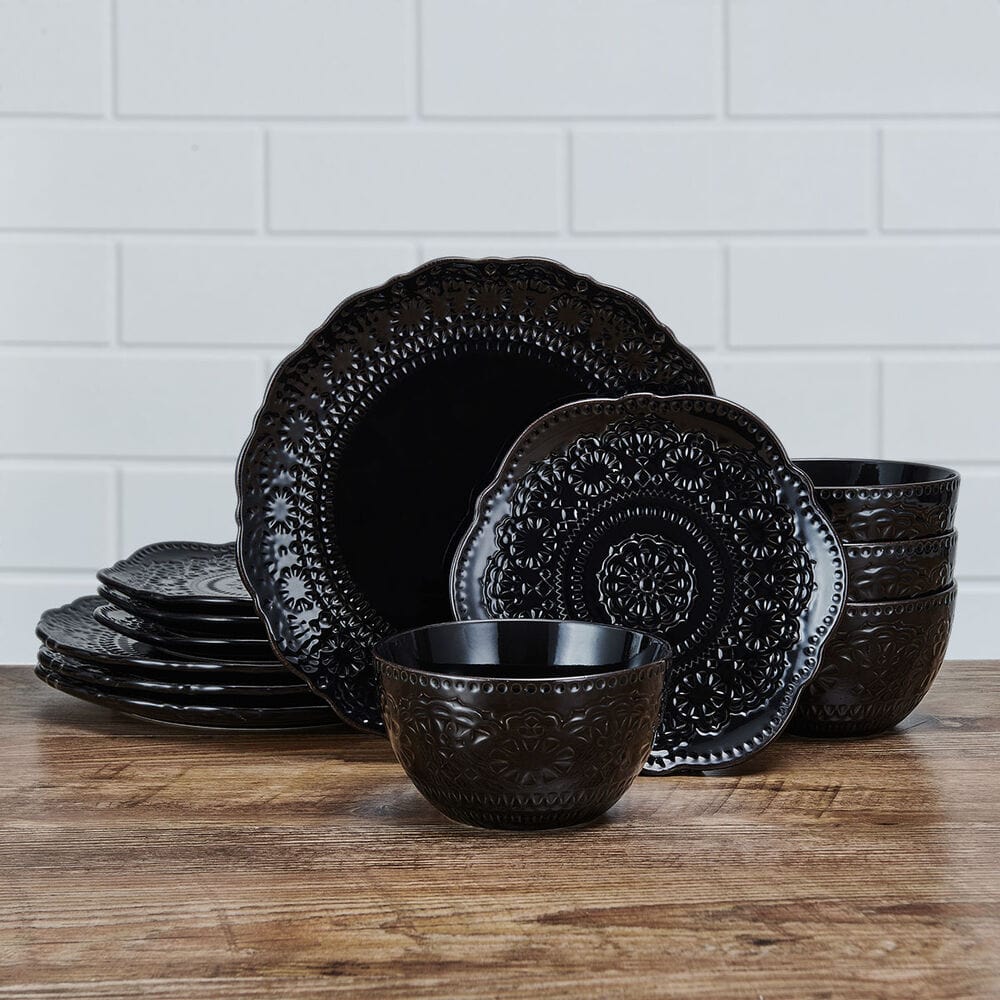Close-up of Chateau Midnight black stoneware dinner plate with scalloped edges