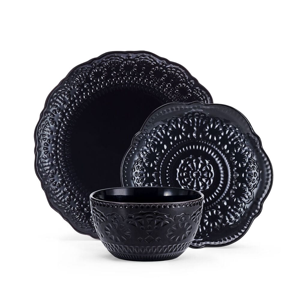 Stacked black stoneware soup bowls with intricate lace pattern