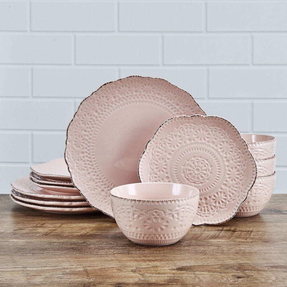 Close-up of Chateau Pink dinnerware with scalloped edges and lace pattern