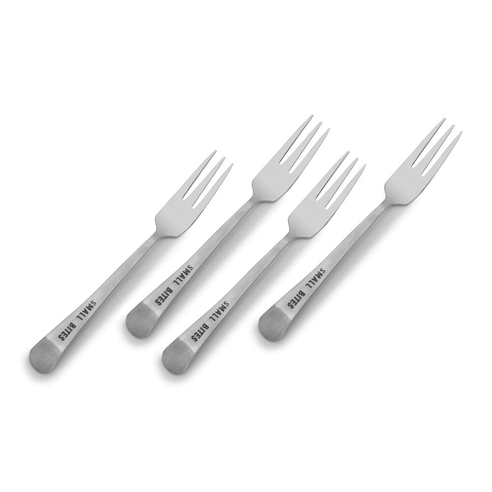 Close-up of charming appetizer forks, showcasing their delicate design.