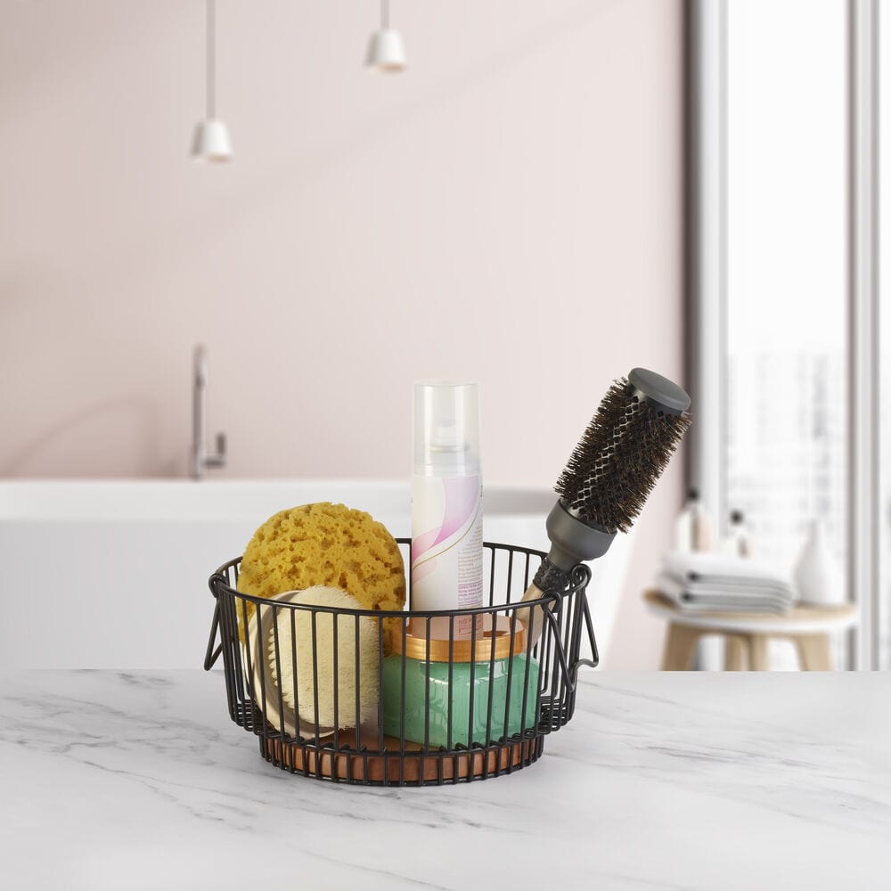 Top view of the wire fruit basket showing breathable design and mango wood base