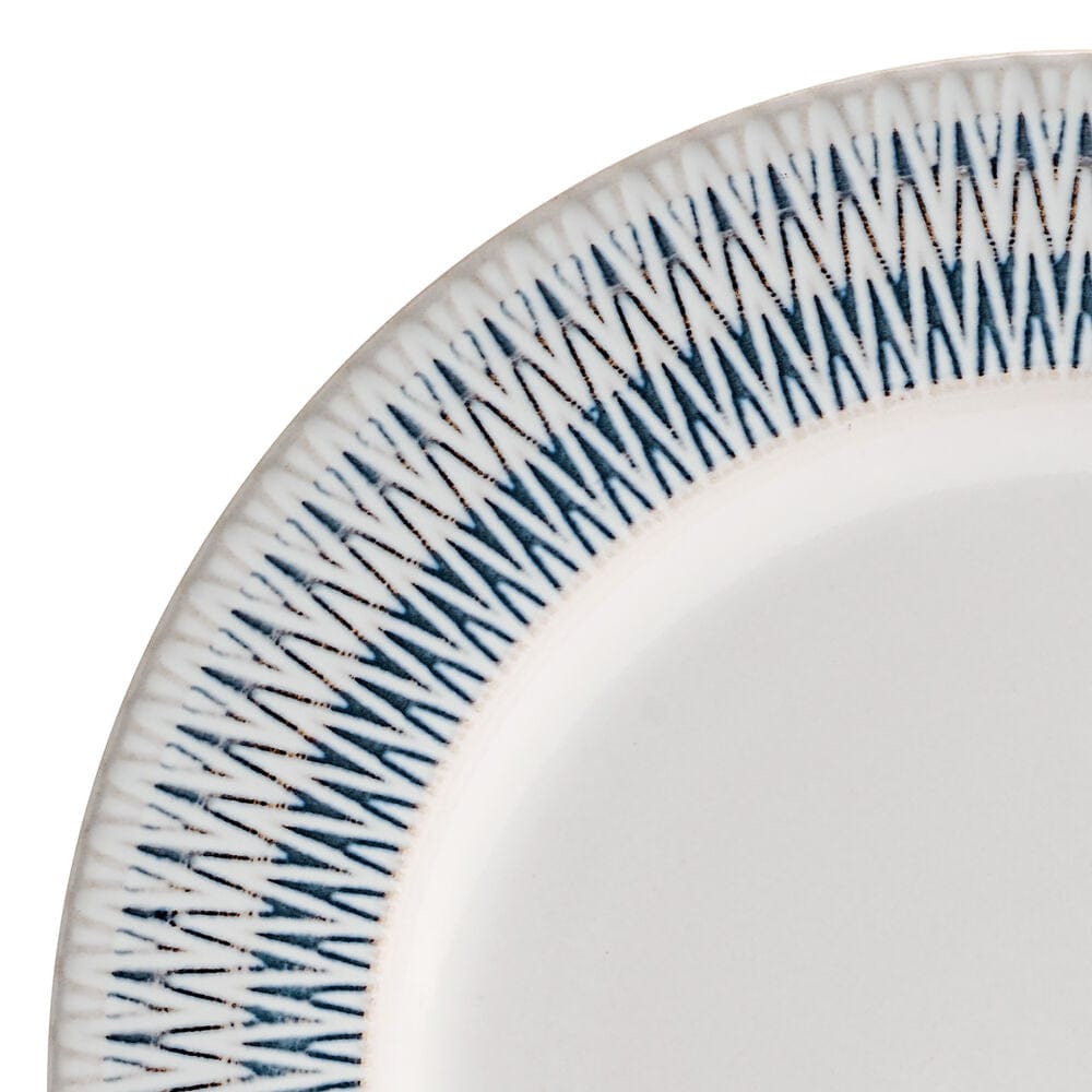 Close-up of Casey Stoneware dinnerware set for 4, showing the unique embossed details and hand-crafted finish.