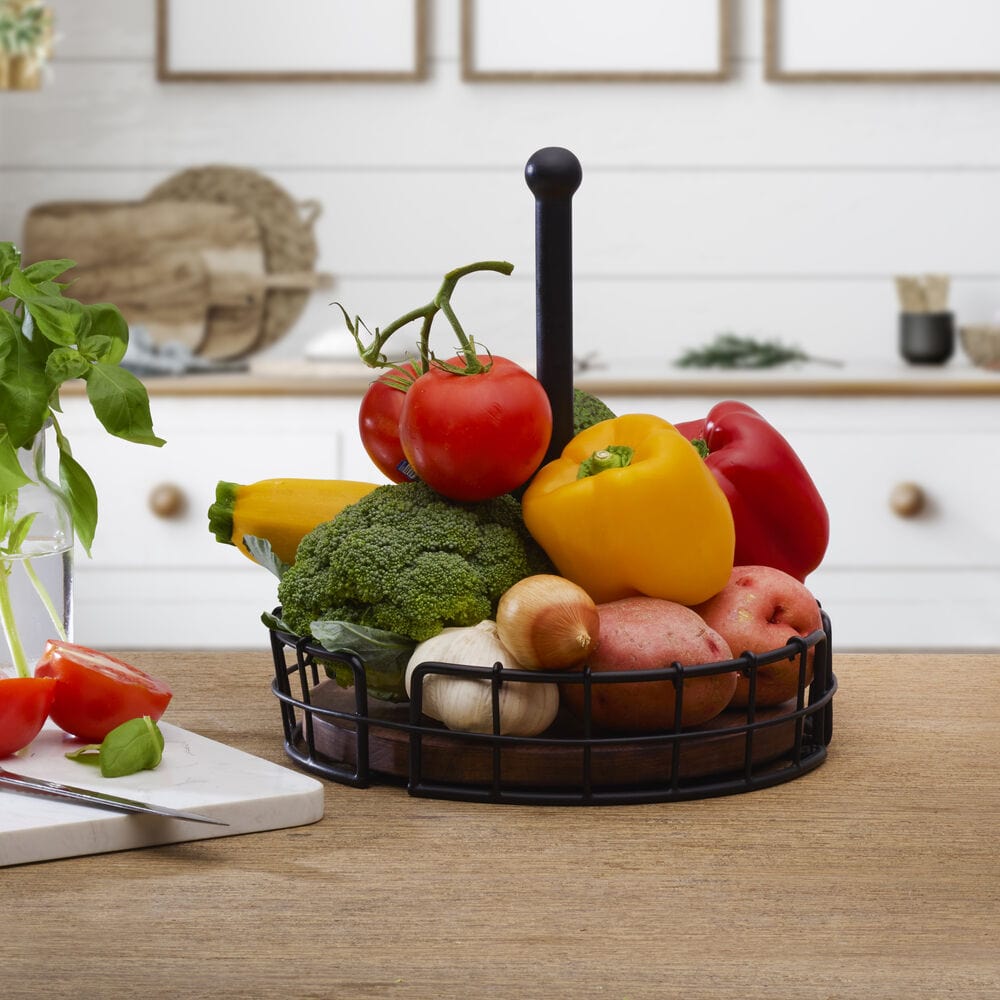 Stylish black wire condiment caddy with natural wood platform on a dining table