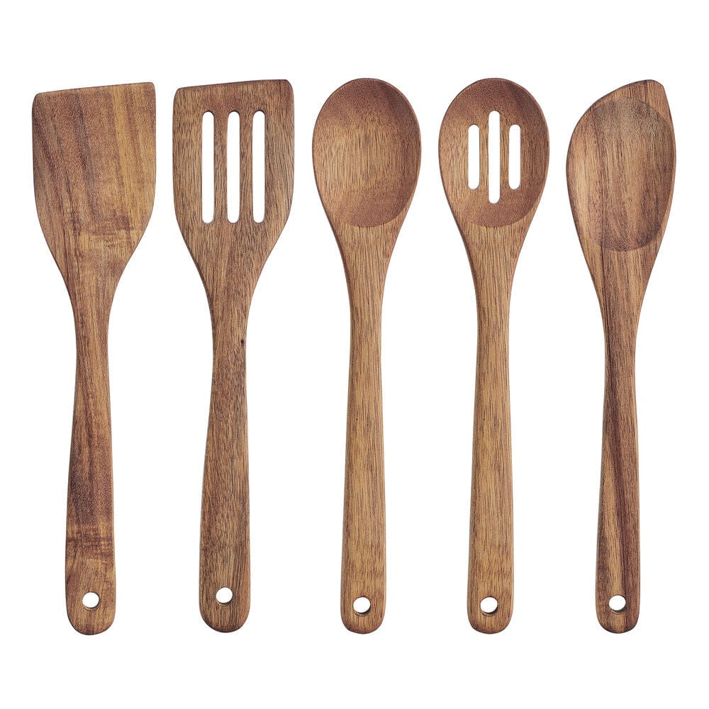 Set of wooden cooking utensils in a stylish white crock