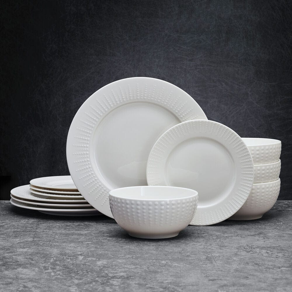 Set of 12-piece dinnerware for 4 people, arranged on dining table