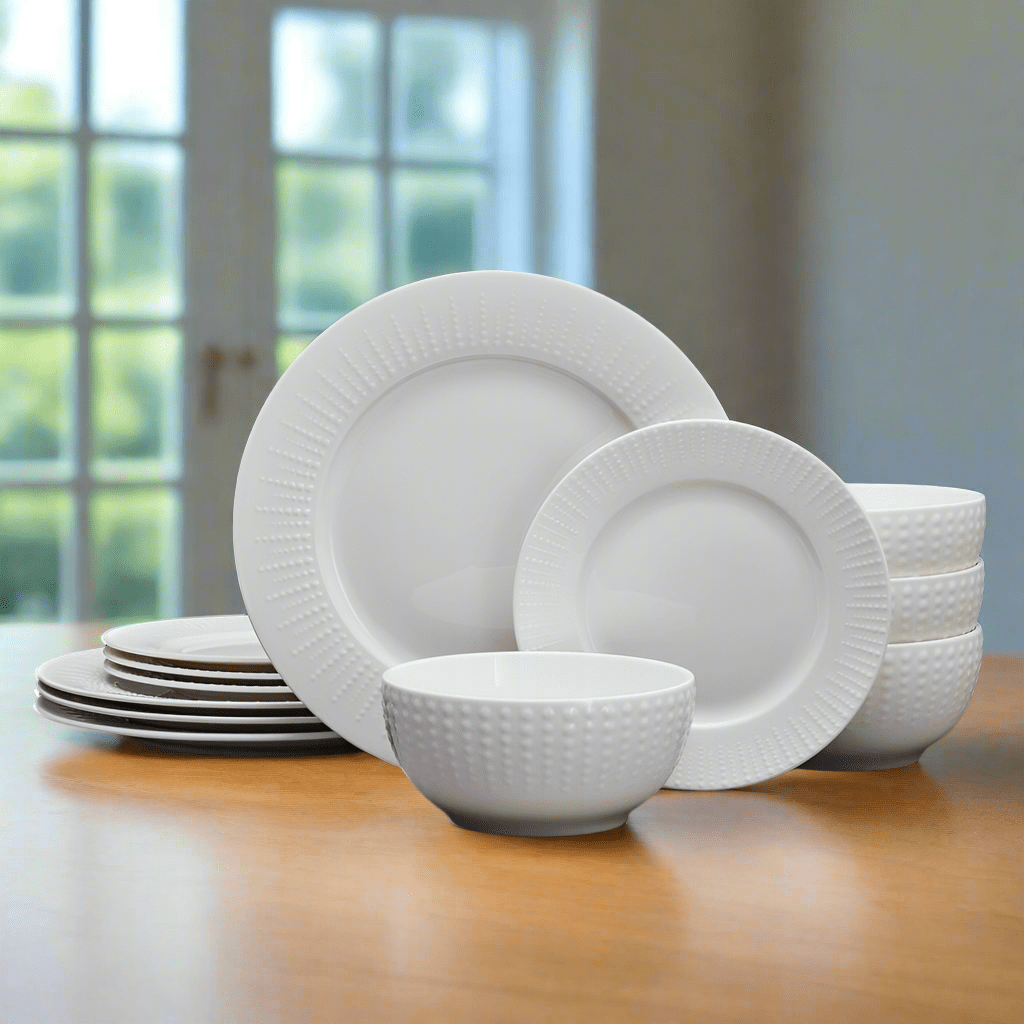 Close-up of embossed white porcelain dinnerware with beaded design