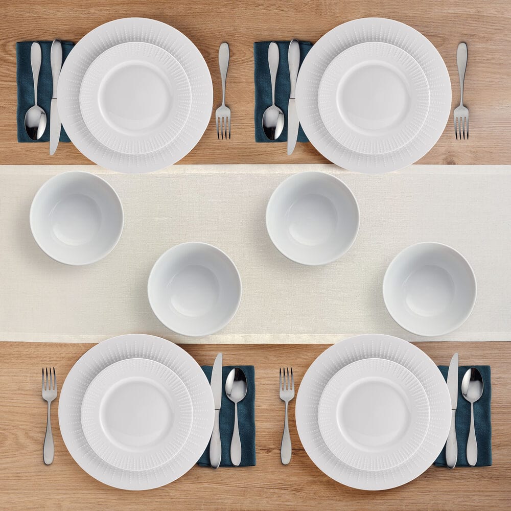 Set of 12-piece dinnerware for 4 people, arranged on dining table