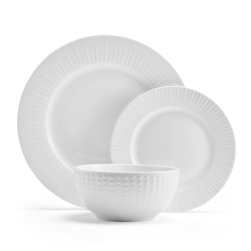 Close-up of embossed white porcelain dinnerware with beaded design