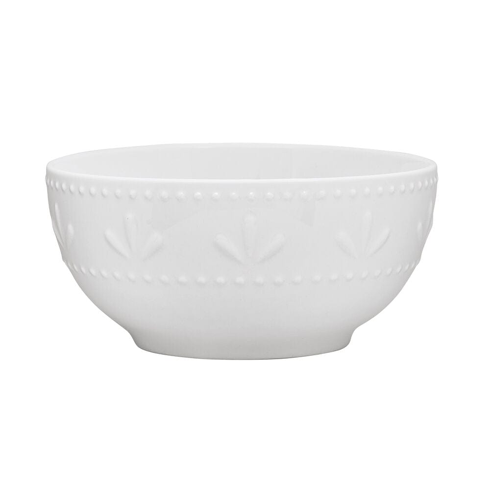 Close-up of embossed beaded rims on porcelain dinnerware set for four