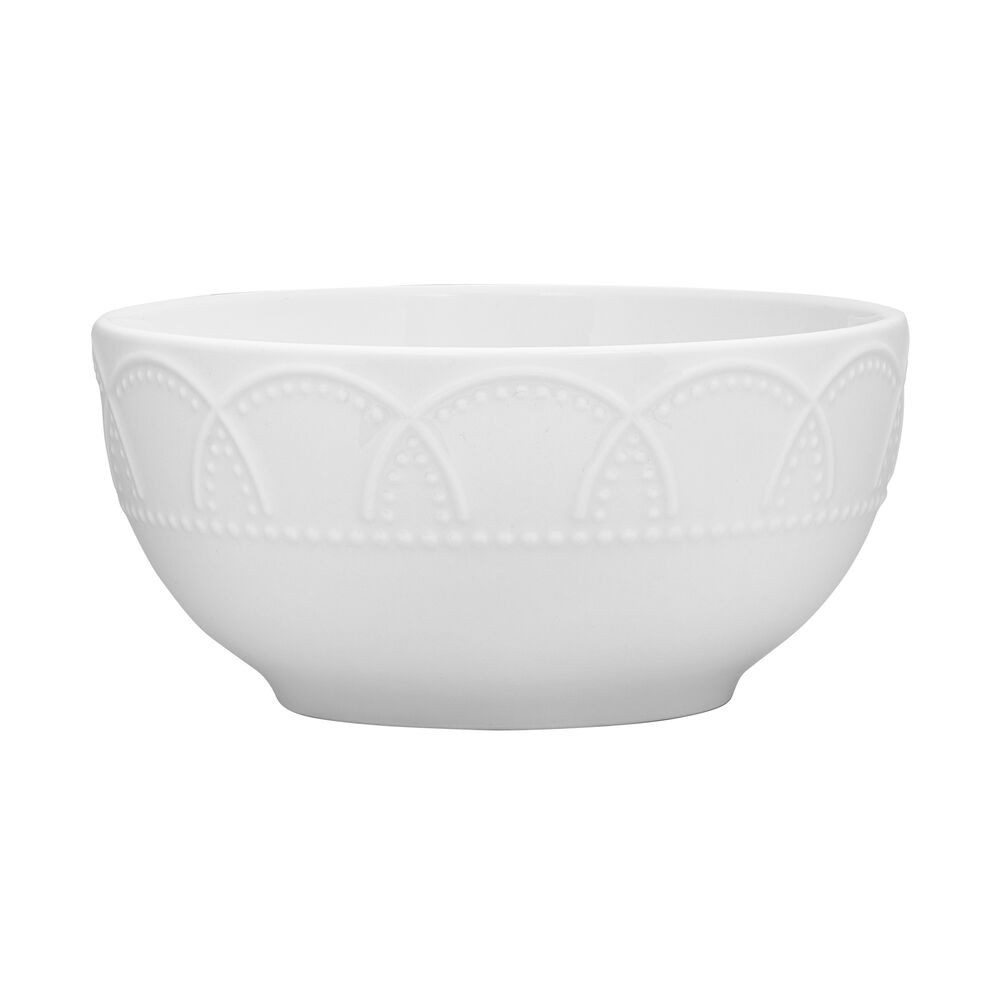 Elegant porcelain dinnerware set displayed on a dining table for light entertaining