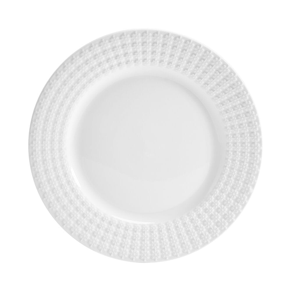 Square embossed white porcelain dinnerware set displayed on a dining table