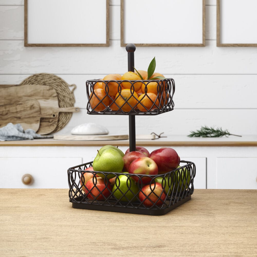 Juliette multi-tier wire storage basket displaying fresh fruits on a kitchen counter.
