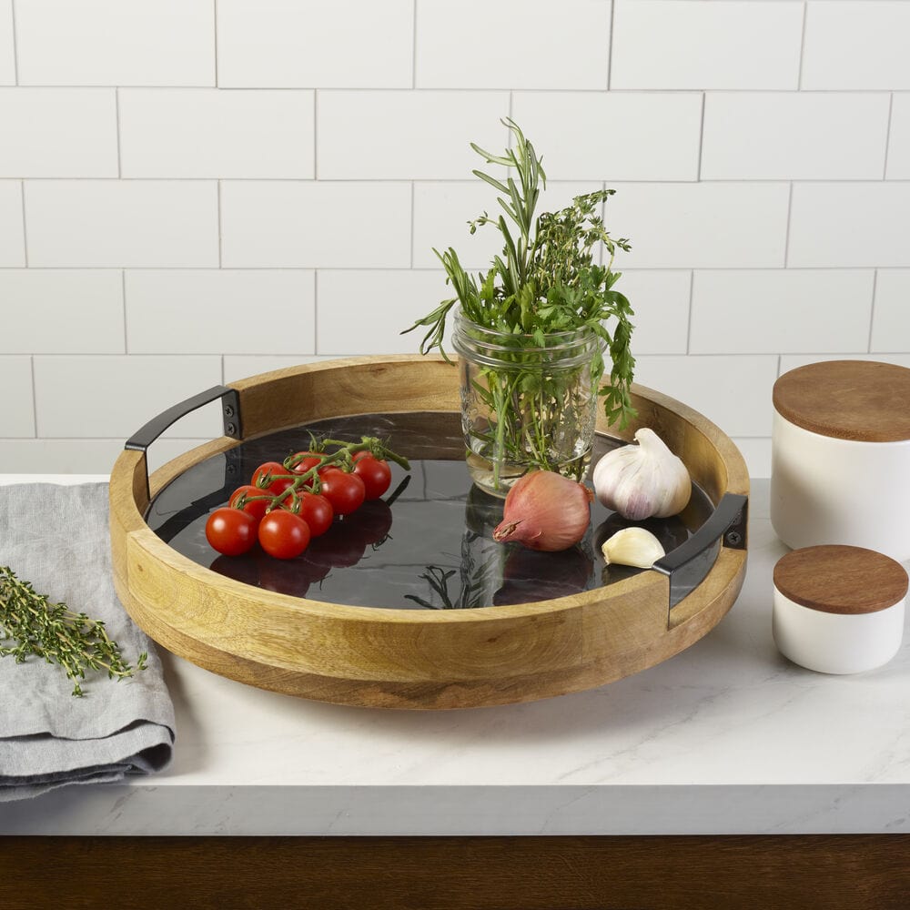 Top view of the black marble lazy susan demonstrating its rotating feature for serving
