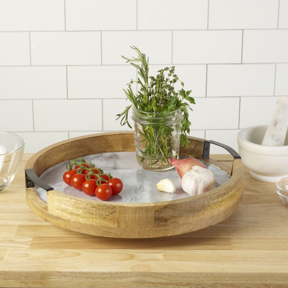 Stylish dining table with the modern marble serve tray in use during a gathering.