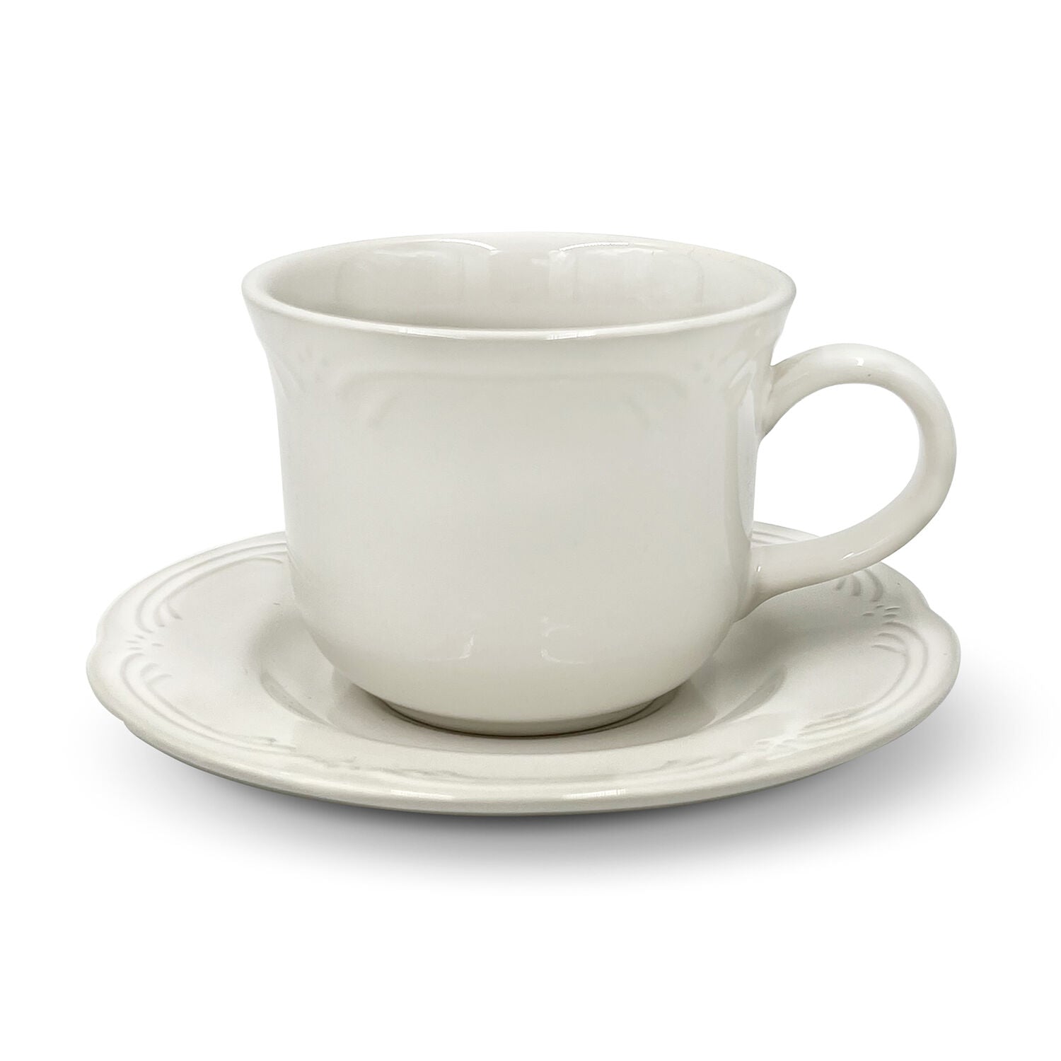 Elegant stoneware tea cup and saucer set with embossed design on a table setting.