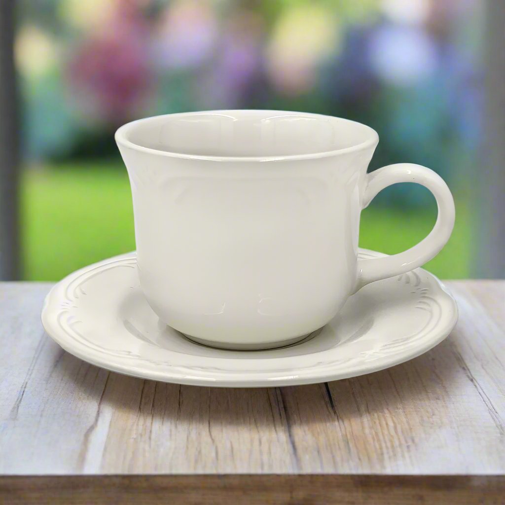 Affordable stoneware tea cup set displayed alongside fresh pastries.