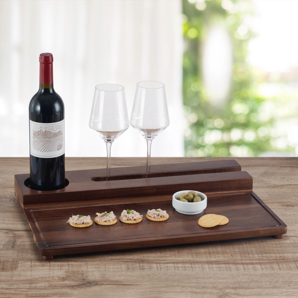 Close-up of acacia wood tray with wine glasses and cheese for entertaining
