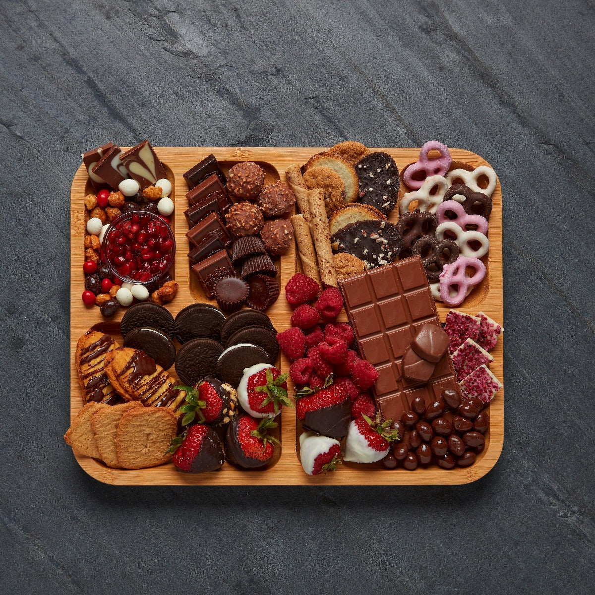 Portable food presentation board with lid during outdoor picnic setting