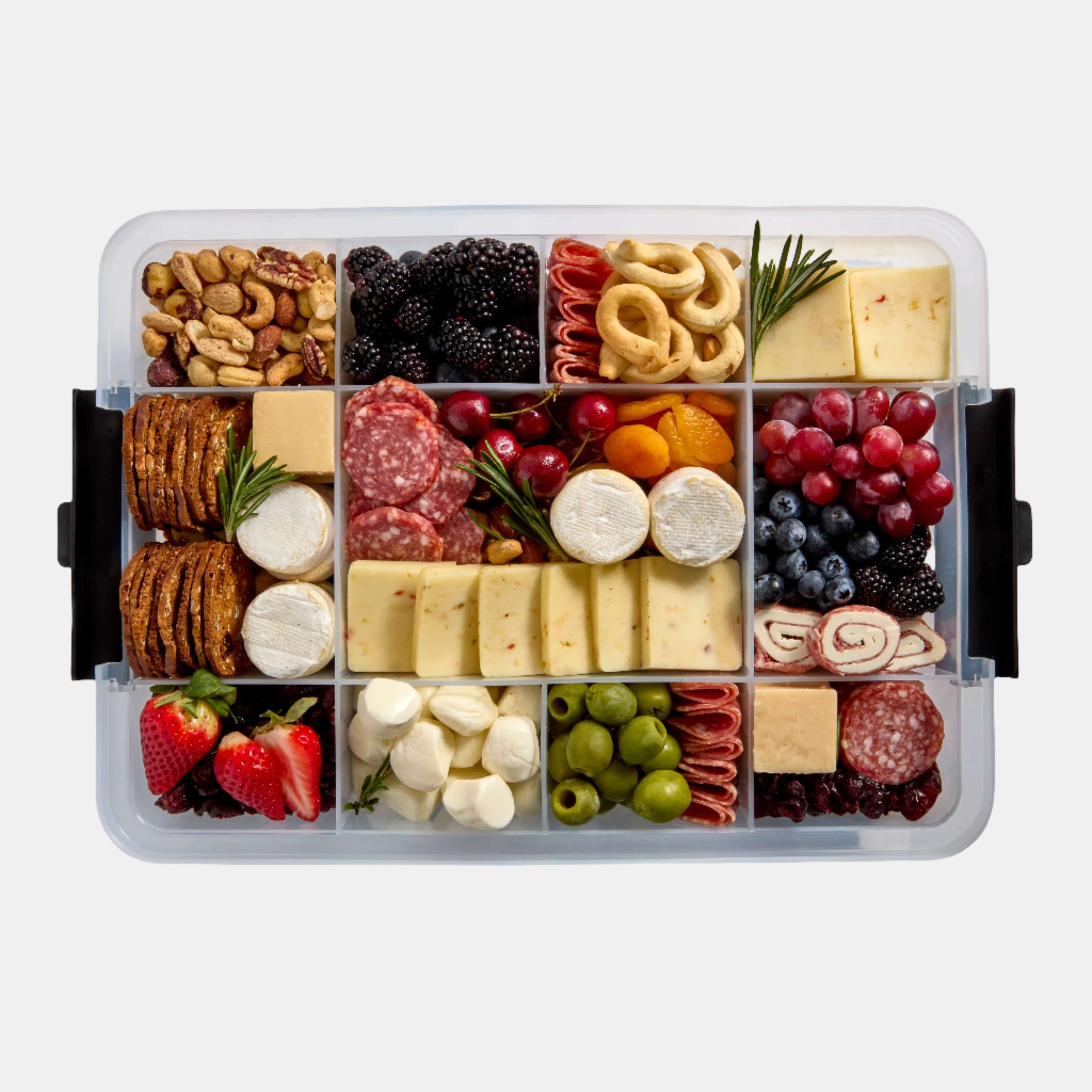 Person using the reversible cutting board lid for food prep on the go