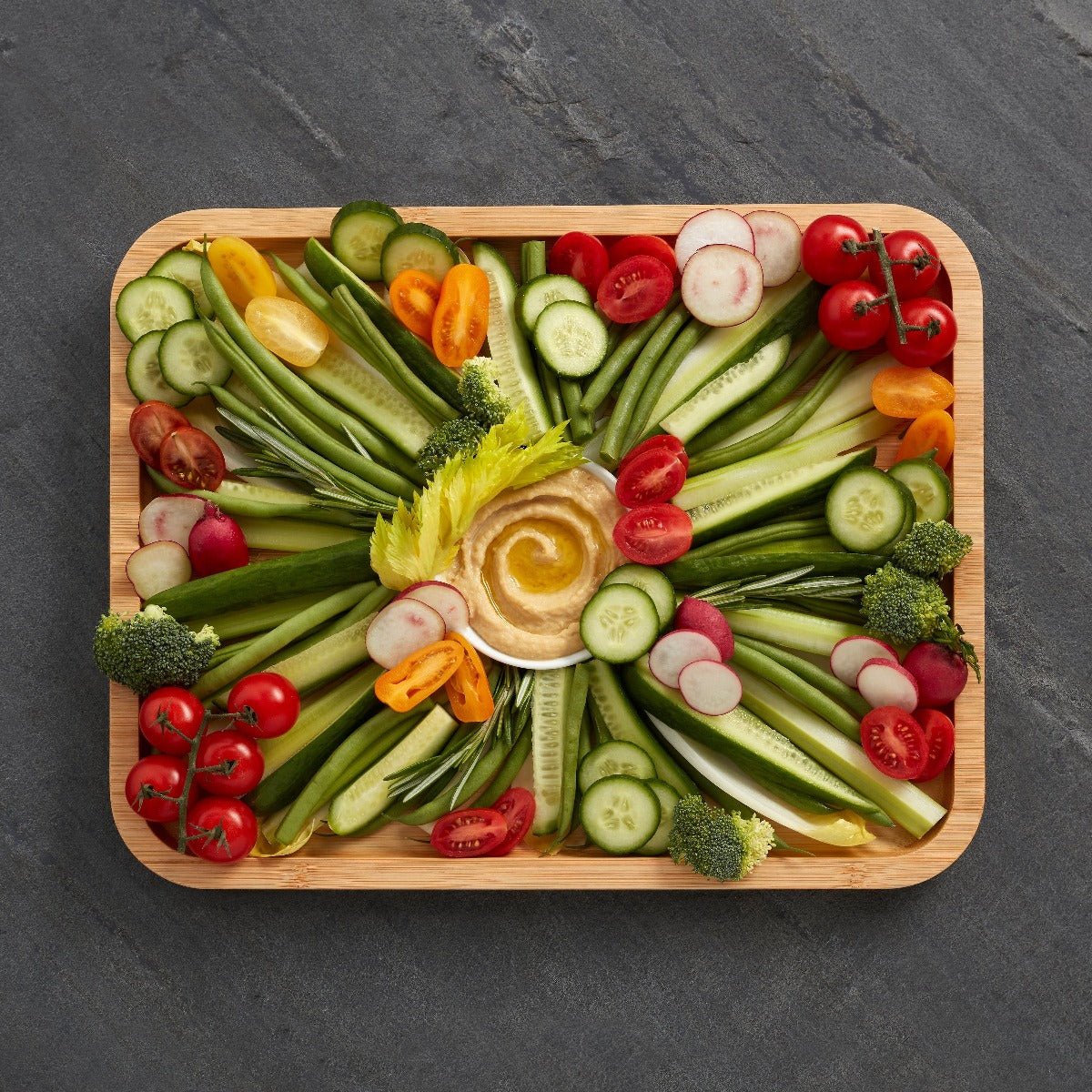 Portable food presentation board with lid during outdoor picnic setting