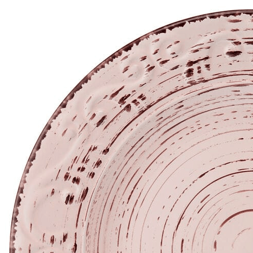 Charming pink stoneware dinnerware set displayed on a modern table setting.