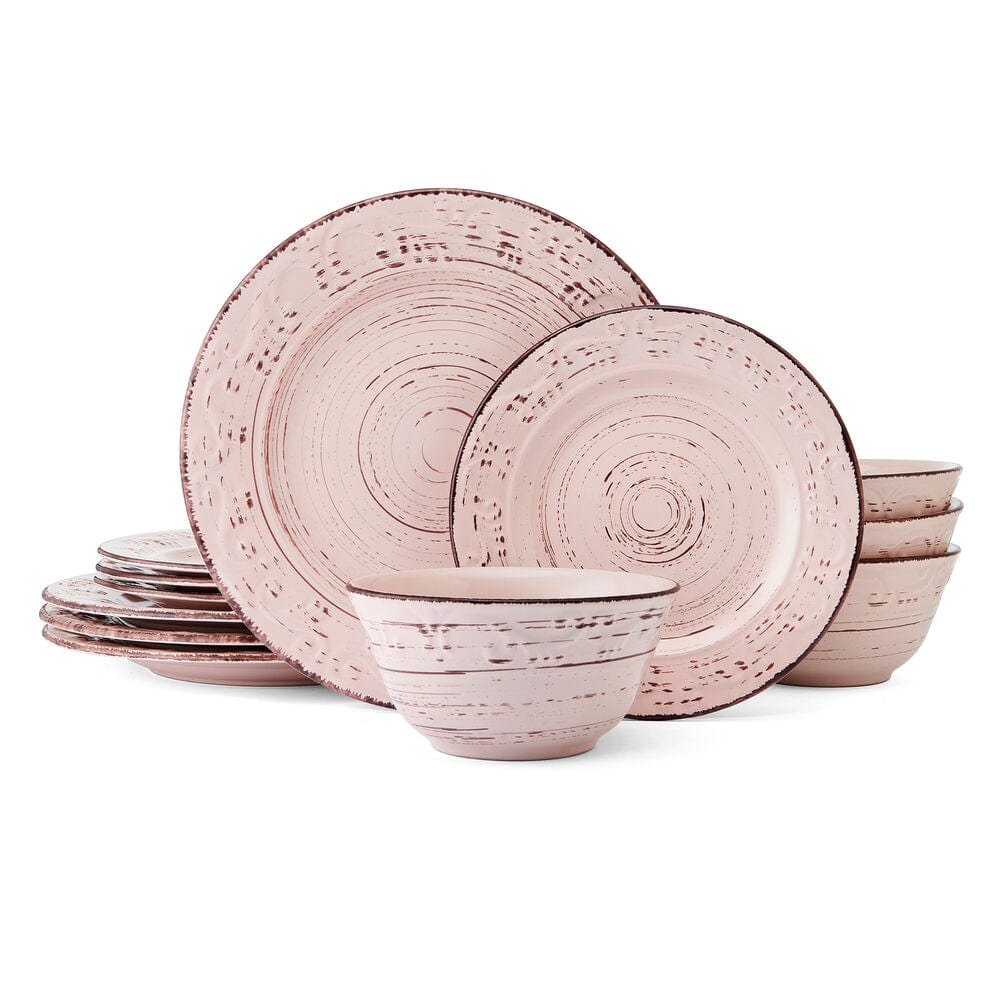 Close-up of the intricate scroll pattern on the pink stoneware dinnerware.