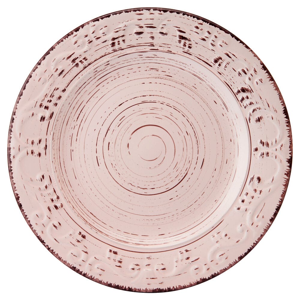 Close-up of the intricate scroll pattern on the pink stoneware dinnerware.