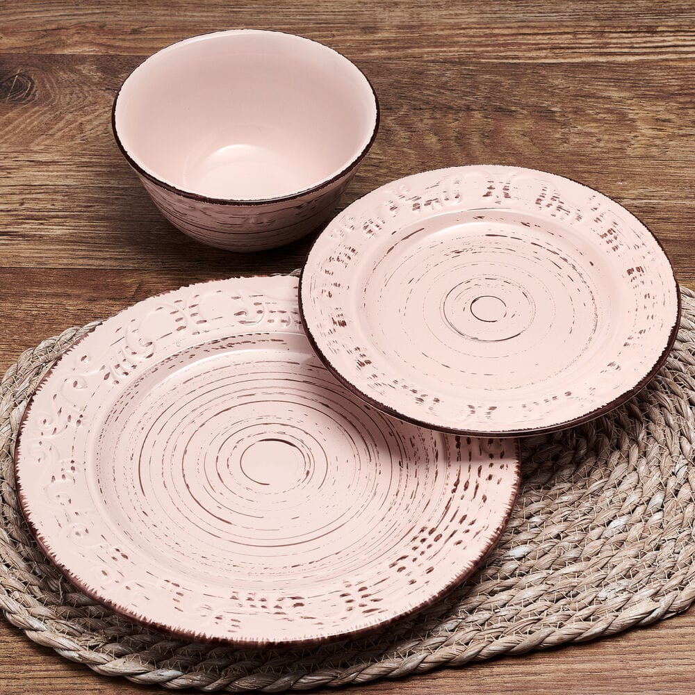 All-purpose bowl from the pink stoneware dinnerware set filled with fresh salad.