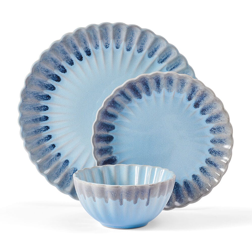 Set of four dinnerware pieces arranged on a dining table for entertaining